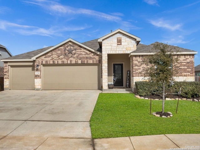 view of front of house with a garage and a front lawn