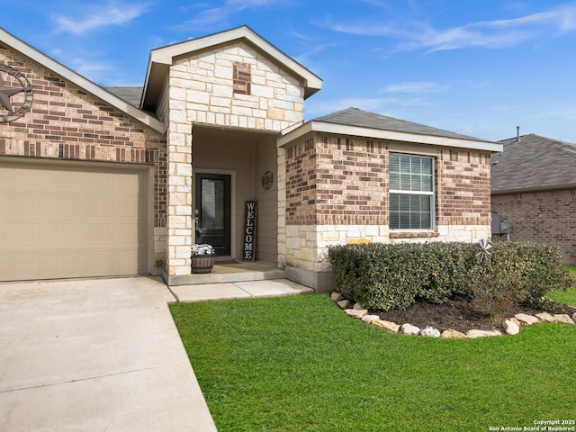 view of front of home featuring a garage and a front lawn