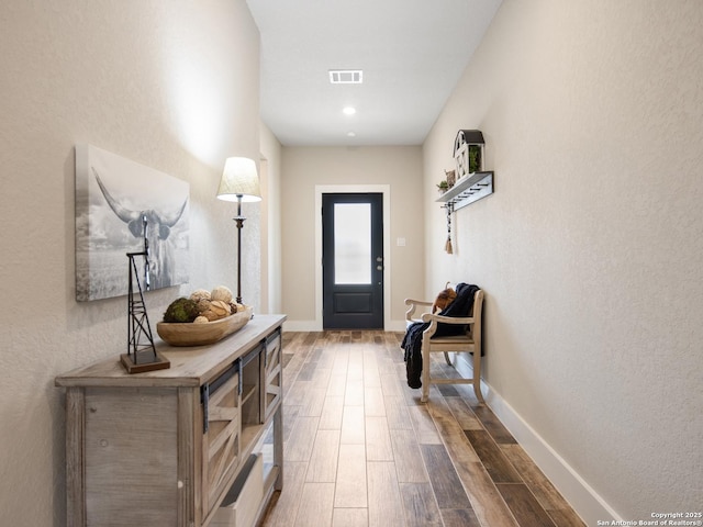 foyer entrance featuring hardwood / wood-style flooring