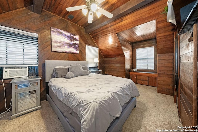 carpeted bedroom featuring wood ceiling, ceiling fan, multiple windows, and wood walls