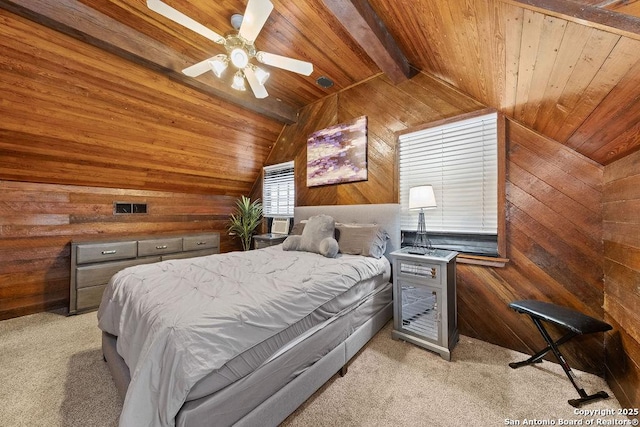 carpeted bedroom featuring ceiling fan, vaulted ceiling with beams, wood ceiling, and wooden walls