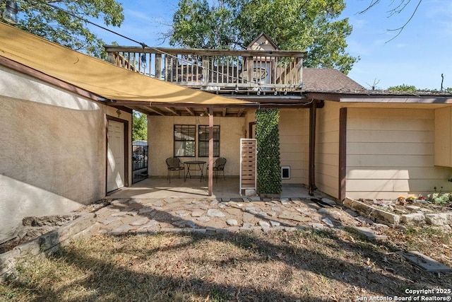 back of house with a patio