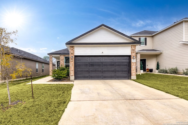 view of front of home with a garage and a front yard