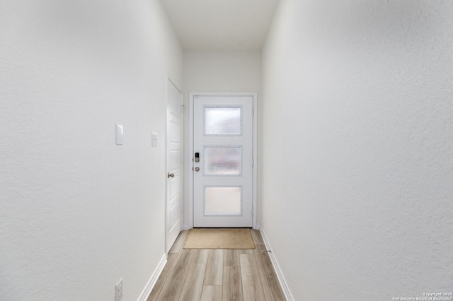 doorway to outside featuring light hardwood / wood-style floors