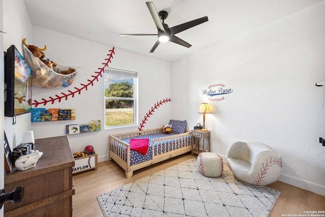 bedroom featuring ceiling fan and light wood-type flooring