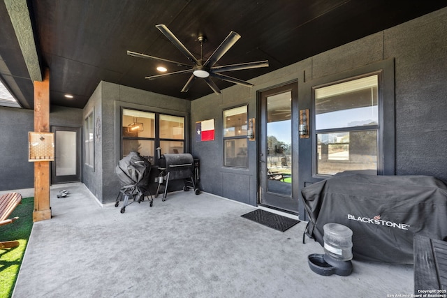 view of patio featuring area for grilling and ceiling fan