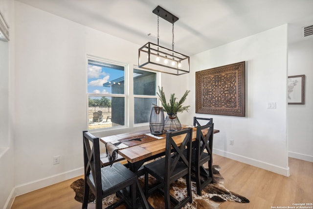 dining area featuring hardwood / wood-style flooring