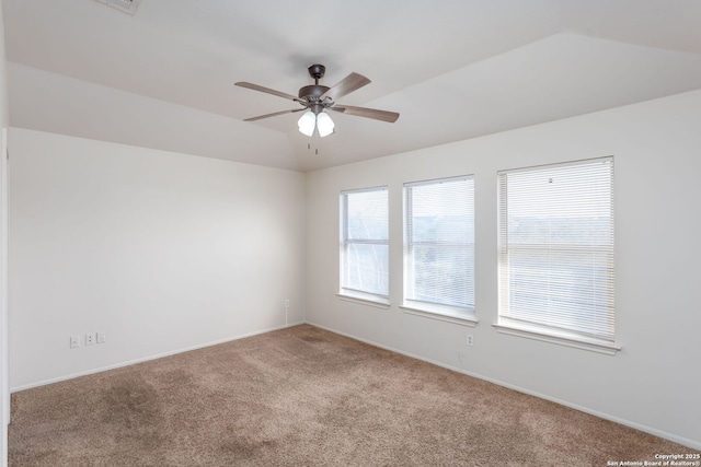 empty room featuring carpet floors and ceiling fan