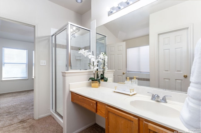 bathroom with vanity and a shower with shower door