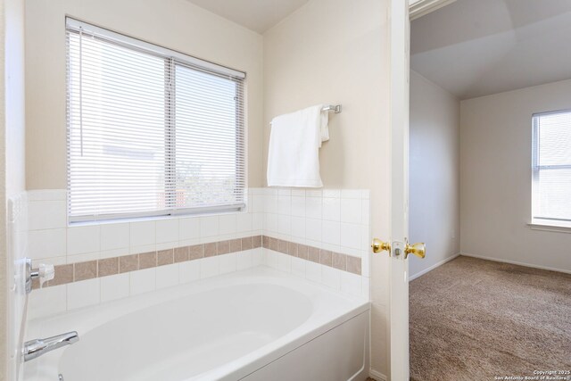 bathroom with a tub