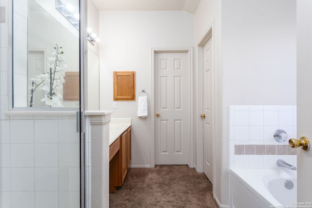 bathroom with vanity and independent shower and bath