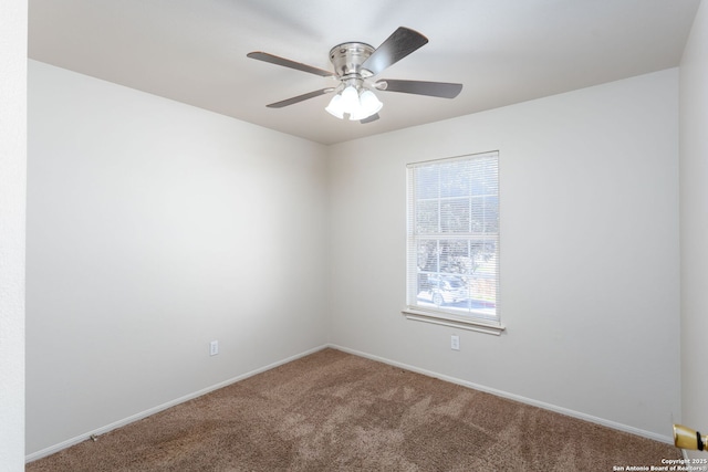 empty room featuring carpet floors and ceiling fan