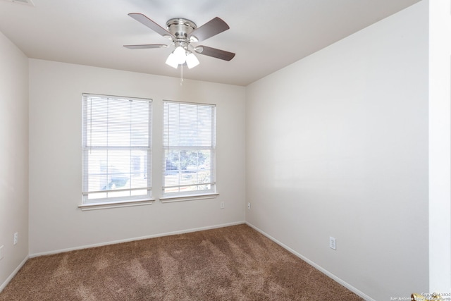 empty room with ceiling fan and carpet flooring