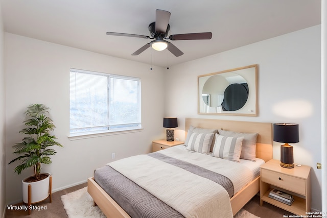 carpeted bedroom featuring ceiling fan