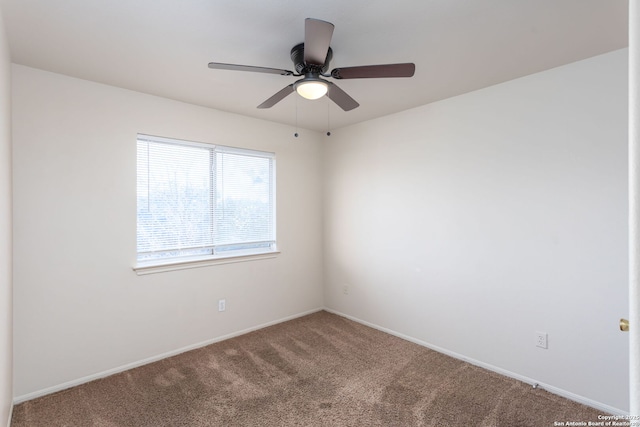 carpeted empty room with ceiling fan