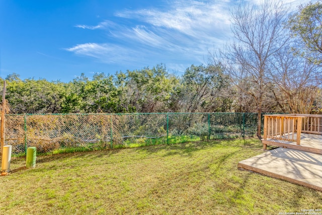 view of yard with a wooden deck