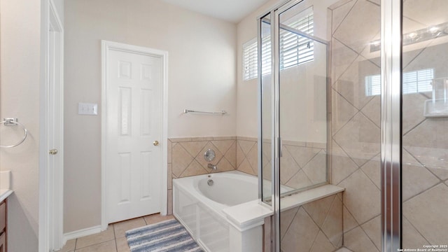 bathroom featuring vanity, separate shower and tub, and tile patterned floors