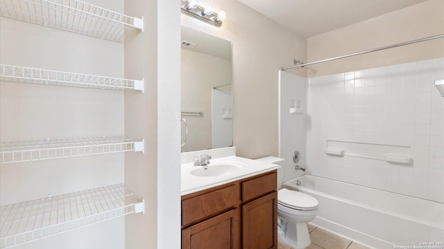 full bathroom featuring bathtub / shower combination, tile patterned floors, toilet, and vanity