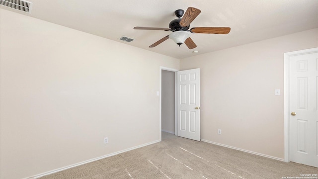 carpeted empty room with ceiling fan