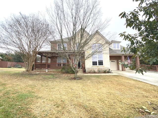 view of front of property with a garage and a front yard