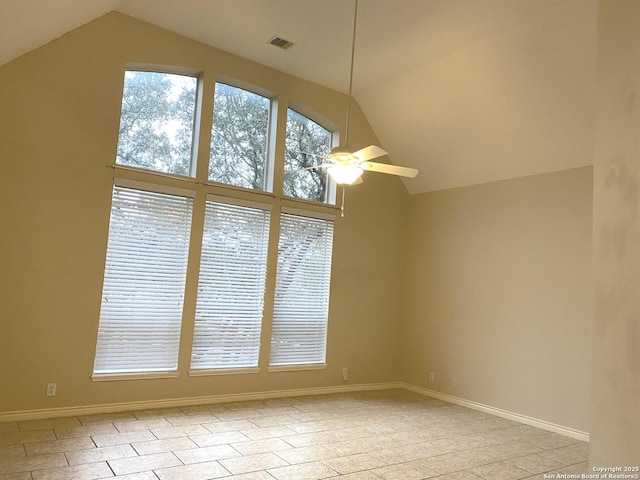 empty room featuring vaulted ceiling and ceiling fan