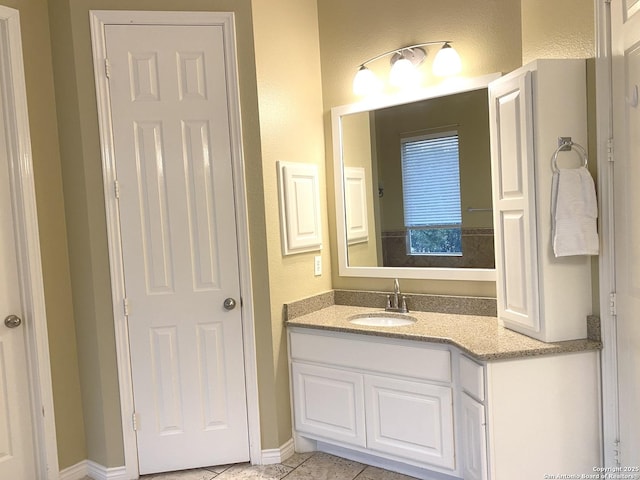 bathroom featuring tile patterned floors and vanity