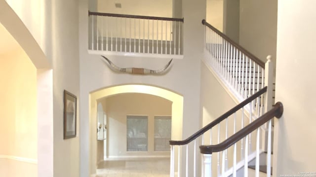 stairway with a high ceiling