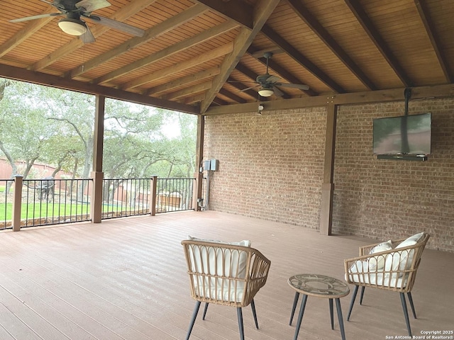 exterior space featuring a wooden deck and ceiling fan