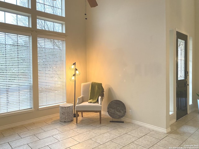 living area featuring light tile patterned flooring and plenty of natural light