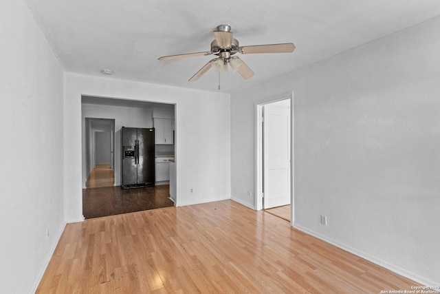 unfurnished living room with ceiling fan and light wood-type flooring