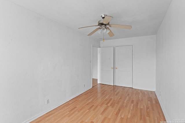 unfurnished bedroom featuring ceiling fan and light wood-type flooring