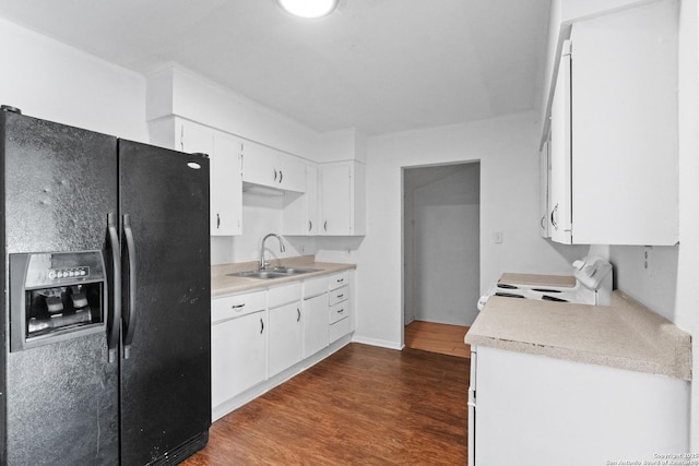 kitchen with sink, white cabinets, dark hardwood / wood-style flooring, stove, and black fridge with ice dispenser