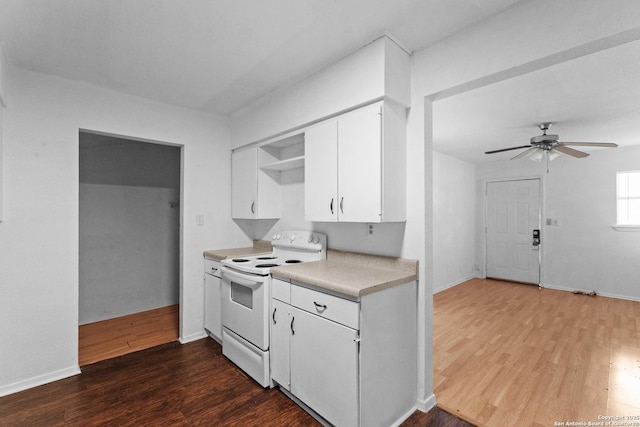 kitchen featuring white cabinetry, dark wood-type flooring, ceiling fan, and electric stove