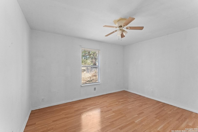 spare room with ceiling fan and light hardwood / wood-style flooring