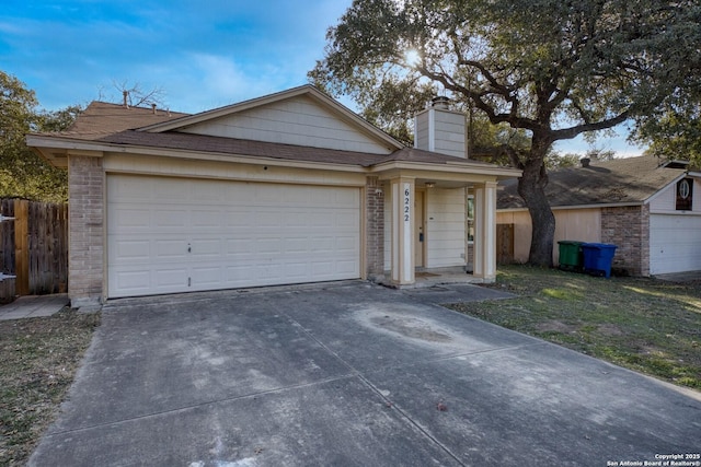 ranch-style house featuring a garage