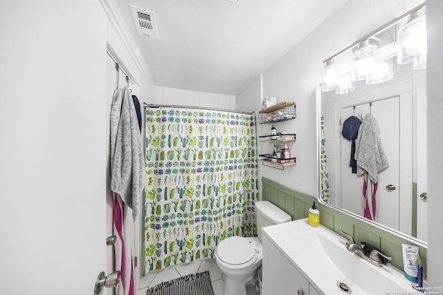 bathroom featuring tile patterned flooring, vanity, curtained shower, and toilet