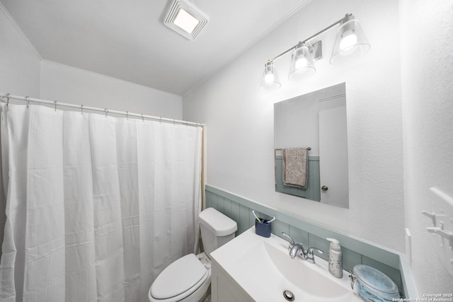 bathroom with vanity, a shower with shower curtain, and toilet