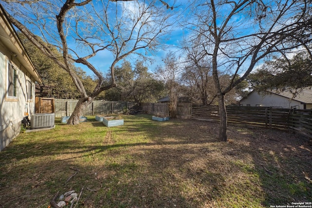 view of yard featuring central AC unit