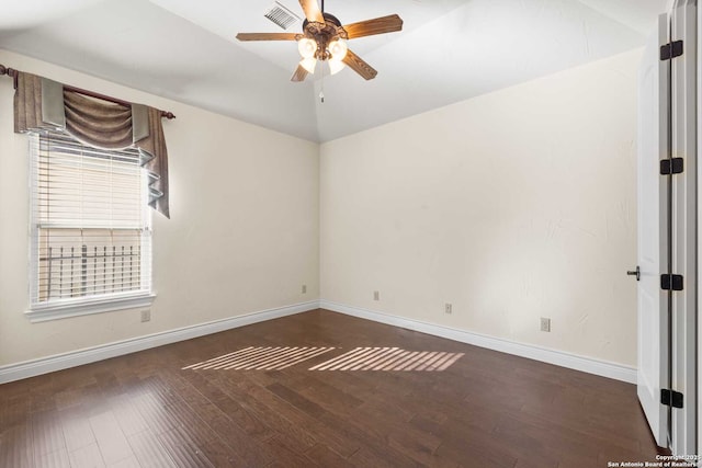 spare room with ceiling fan, lofted ceiling, and dark hardwood / wood-style flooring