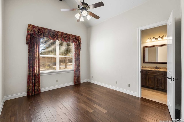 interior space featuring lofted ceiling, dark wood-type flooring, and ceiling fan