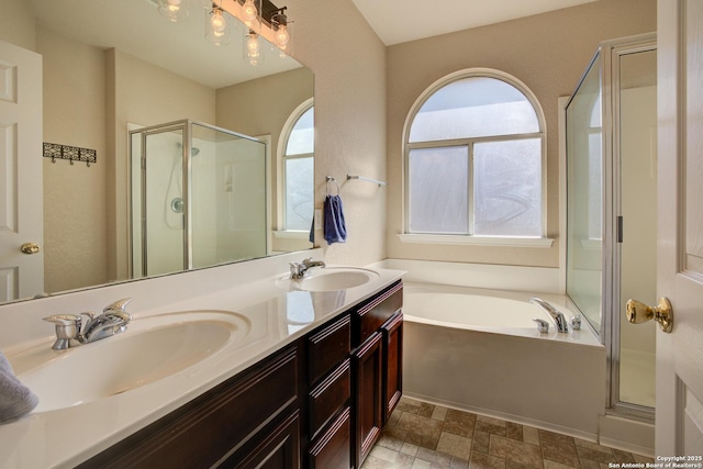 bathroom with vanity and independent shower and bath