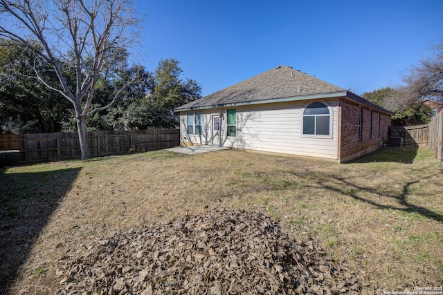 rear view of house with a lawn