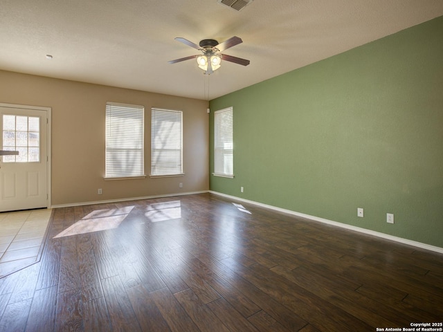 unfurnished room featuring hardwood / wood-style floors and ceiling fan