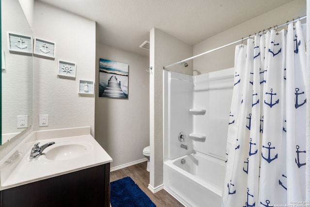 full bathroom with shower / tub combo with curtain, wood-type flooring, toilet, and vanity