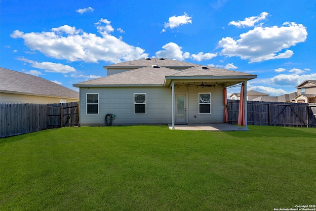 rear view of house with a patio area and a lawn