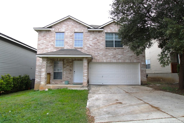 view of front of home with a garage and a front yard