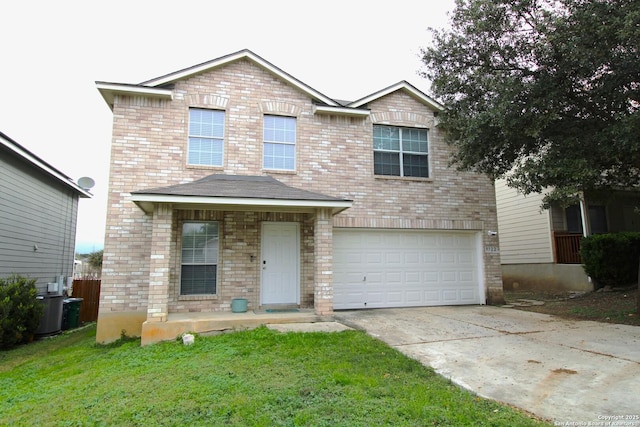 view of front of house with a garage and a front yard