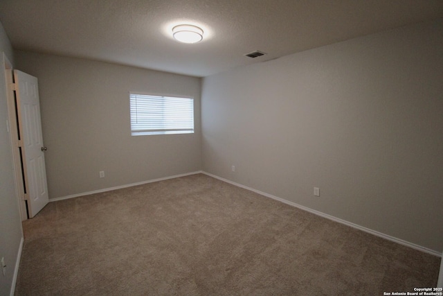 unfurnished room with carpet floors