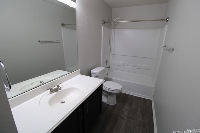 full bathroom featuring vanity, shower / bathing tub combination, hardwood / wood-style floors, and toilet