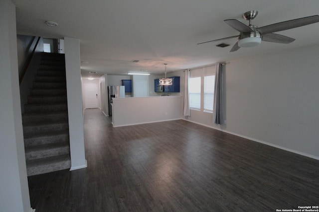 unfurnished living room with dark wood-type flooring and ceiling fan